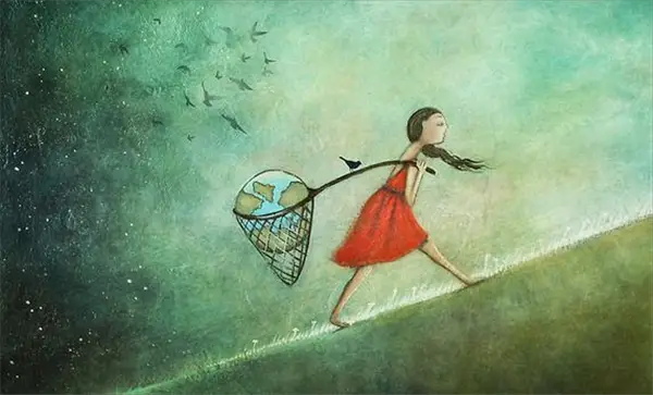 Mujer lleva el mundo en sus manos con la ley de atracción